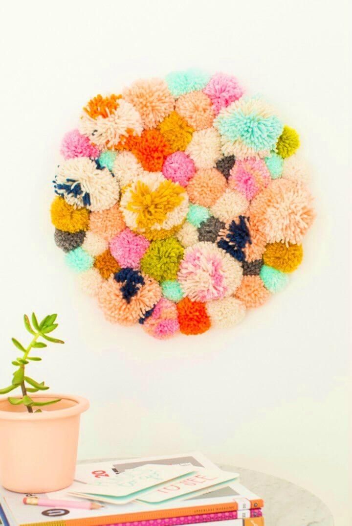 https://media.lostateminor.com/wp-content/uploads/2022/05/Easy-DIY-Pom-Pom-Wall-Hang.jpg