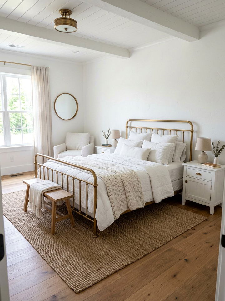Farmhouse white bedroom with gold metal bed - 30 gold and white bedroom ideas