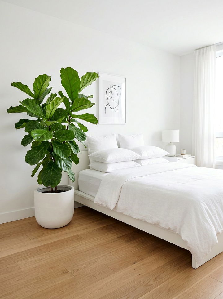 Minimalist white bedroom with green plant - 30 emerald and white bedroom ideas