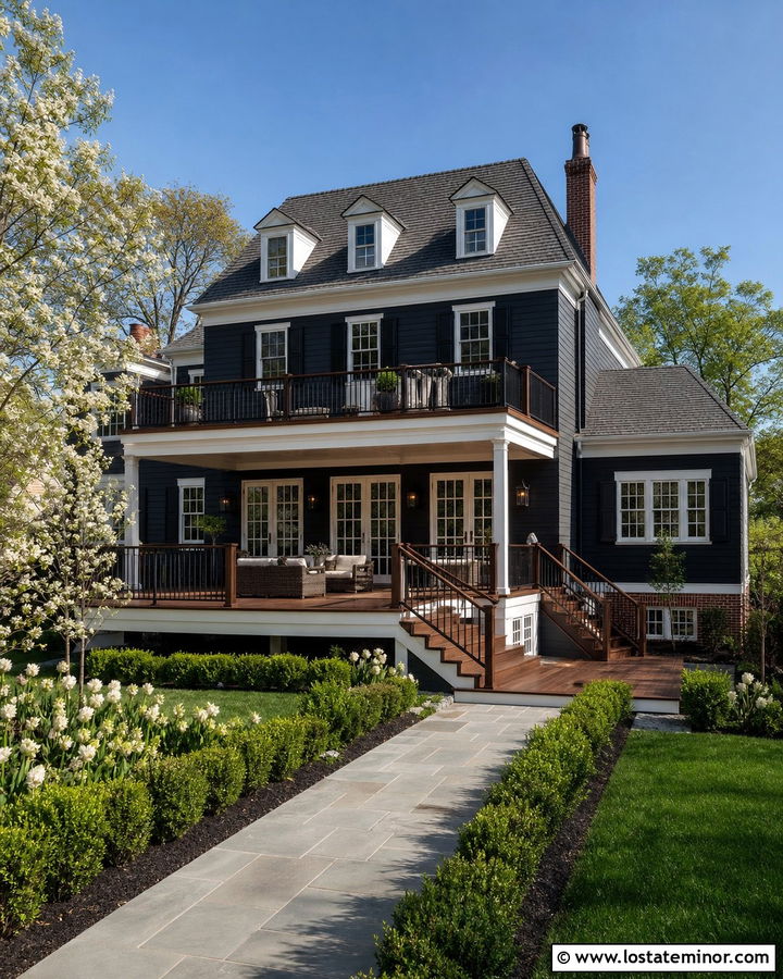 Black Colonial House With Two Level Deck - 30 Black House Design With Deck Ideas
