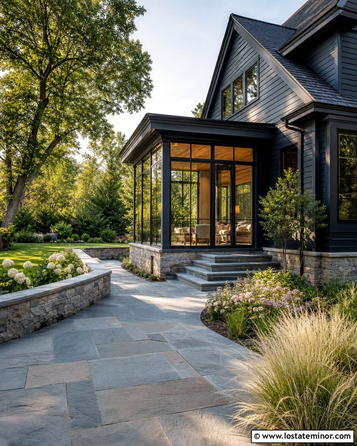 Black House With Sunroom And Stone Patio - 30 Black House Design With Sunroom Ideas