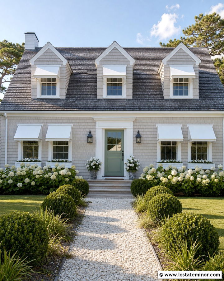 Greige Cape Cod With White Fabric Awnings - 30 Greige House Design With Awning Ideas