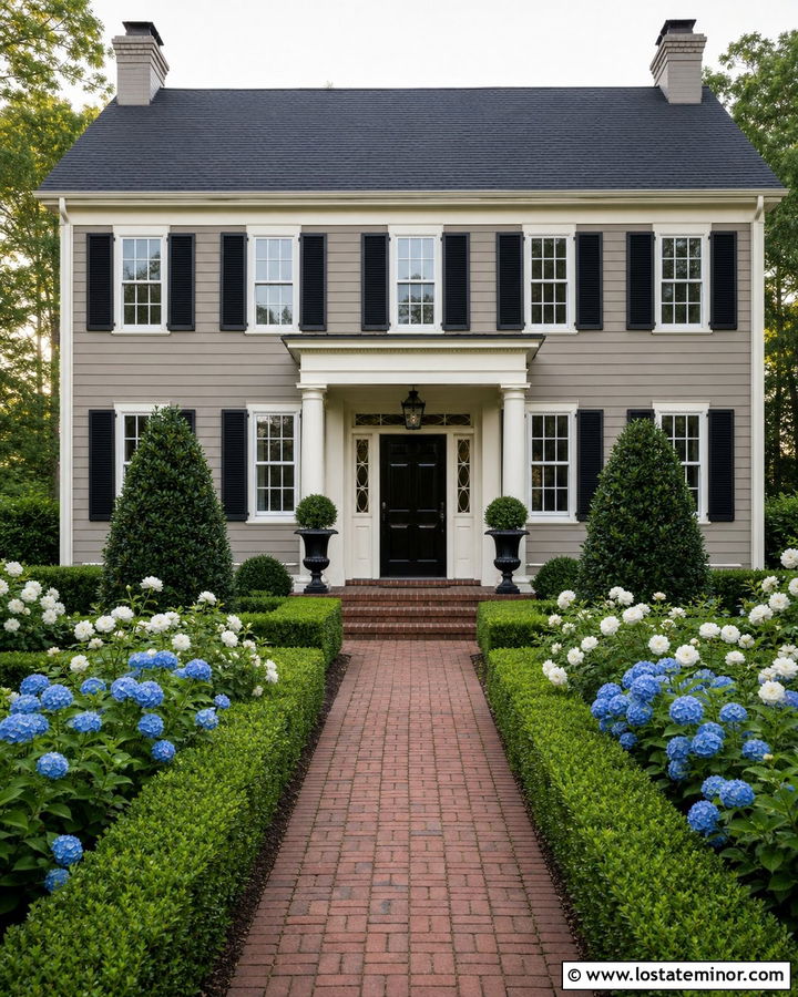 Greige Colonial House With Boxwood Hedges - 30 Greige House Design With Landscaping Ideas