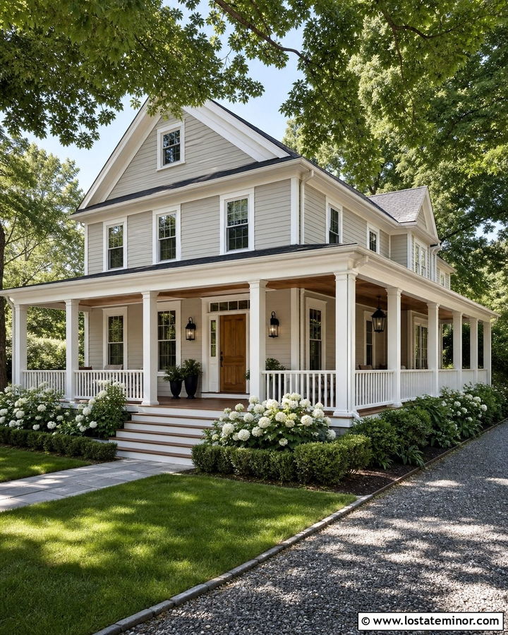 Greige Farmhouse With White Wraparound Railings - 30 Greige House Design With Railings Ideas