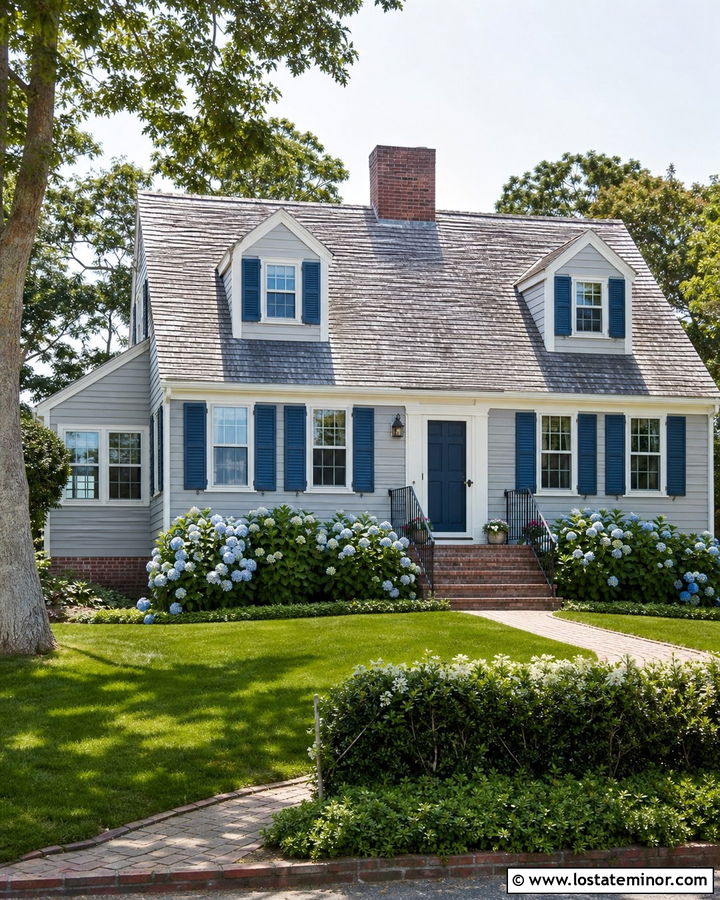 Light Grey Cape Cod With Tan Brick And Blue Door - 30 Light Grey House Design With Brick Accents Ideas
