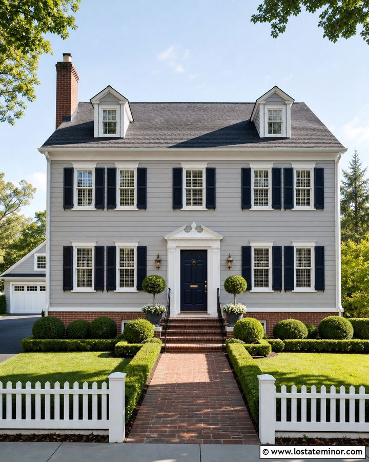 Light Grey Colonial With Red Brick And Navy Shutters - 30 Light Grey House Design With Brick Accents Ideas