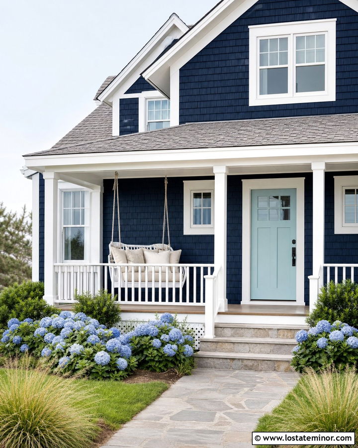 Midnight Blue Coastal Cottage With Wicker Swing - 30 Midnight Blue House Design With Swing Ideas