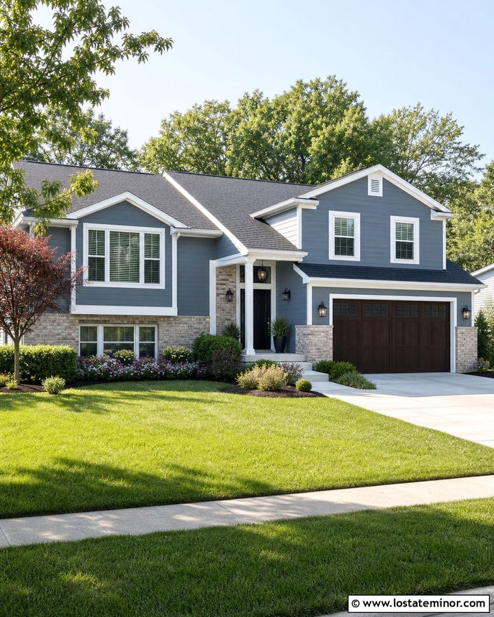 Slate Blue Split Level With Layered Shrubs - 30 Slate Blue House Design With Landscaping Ideas