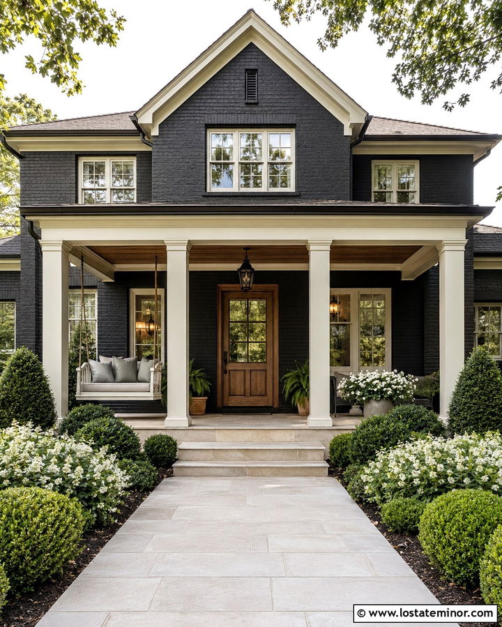 Soft Black Brick House With Cream Porch Swing - 30 Soft Black House Design With Swing Ideas