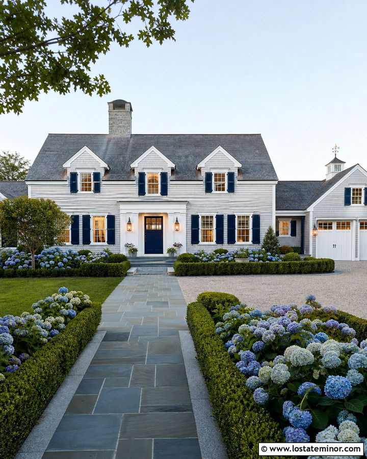 Stone Cape Cod House With Copper Lanterns - 30 Stone House Design With Lighting Ideas