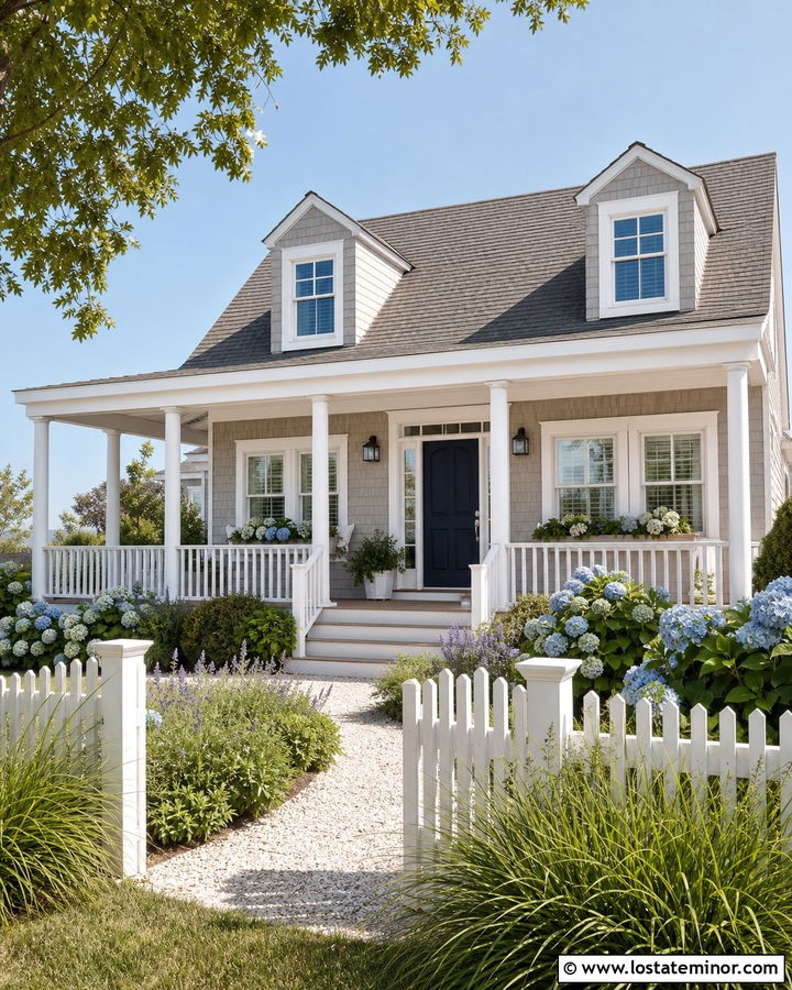 Taupe Cape Cod House With Blue Door And Coastal Landscaping - 30 Taupe House Design With Landscaping Ideas