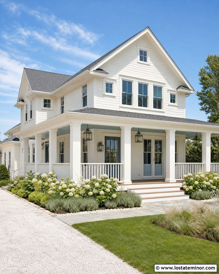 Warm White Coastal House With Blue Door And Columns - 30 Warm White House Design With Porch Columns Ideas