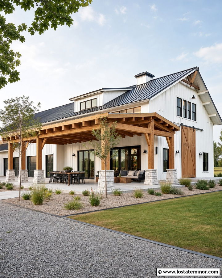 White Barndominium With Large Pergola - 30 White House Design With Pergola Ideas