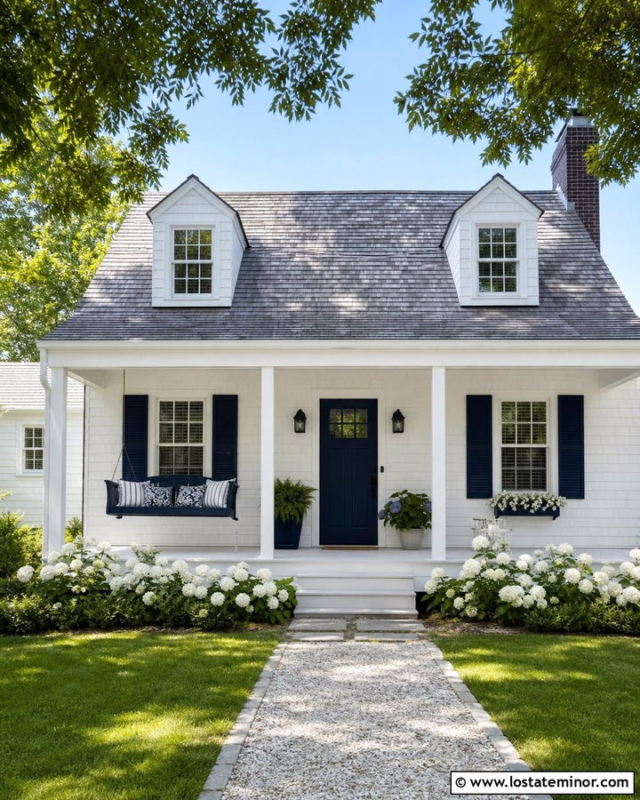 White Cape Cod House With Blue Porch Swing - 30 White House Design With Swing Ideas
