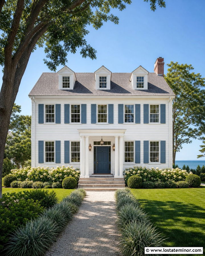 White Coastal Colonial With White Frames And Blue Shutters - 30 White House Design With Window Frames Ideas
