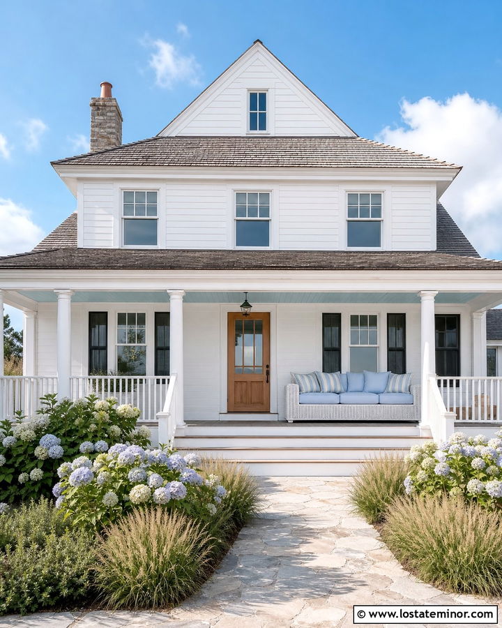 White Coastal House With Blue Daybed - 30 White House Design With Daybed Ideas
