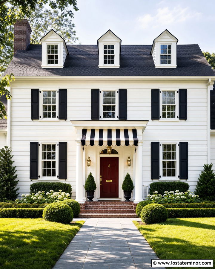 White Colonial House With Striped Awning - 30 White House Design With Awning Ideas